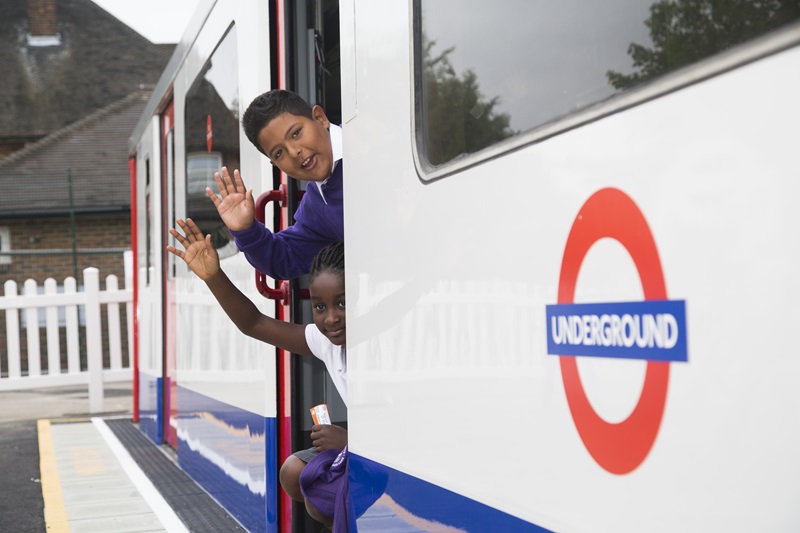 Kids Waving Inside a London Underground Train - Mace Group
