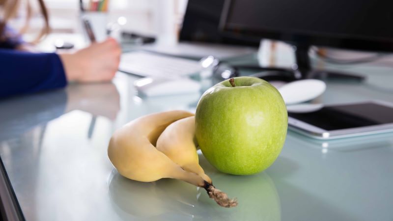 Banana and apple on a table 