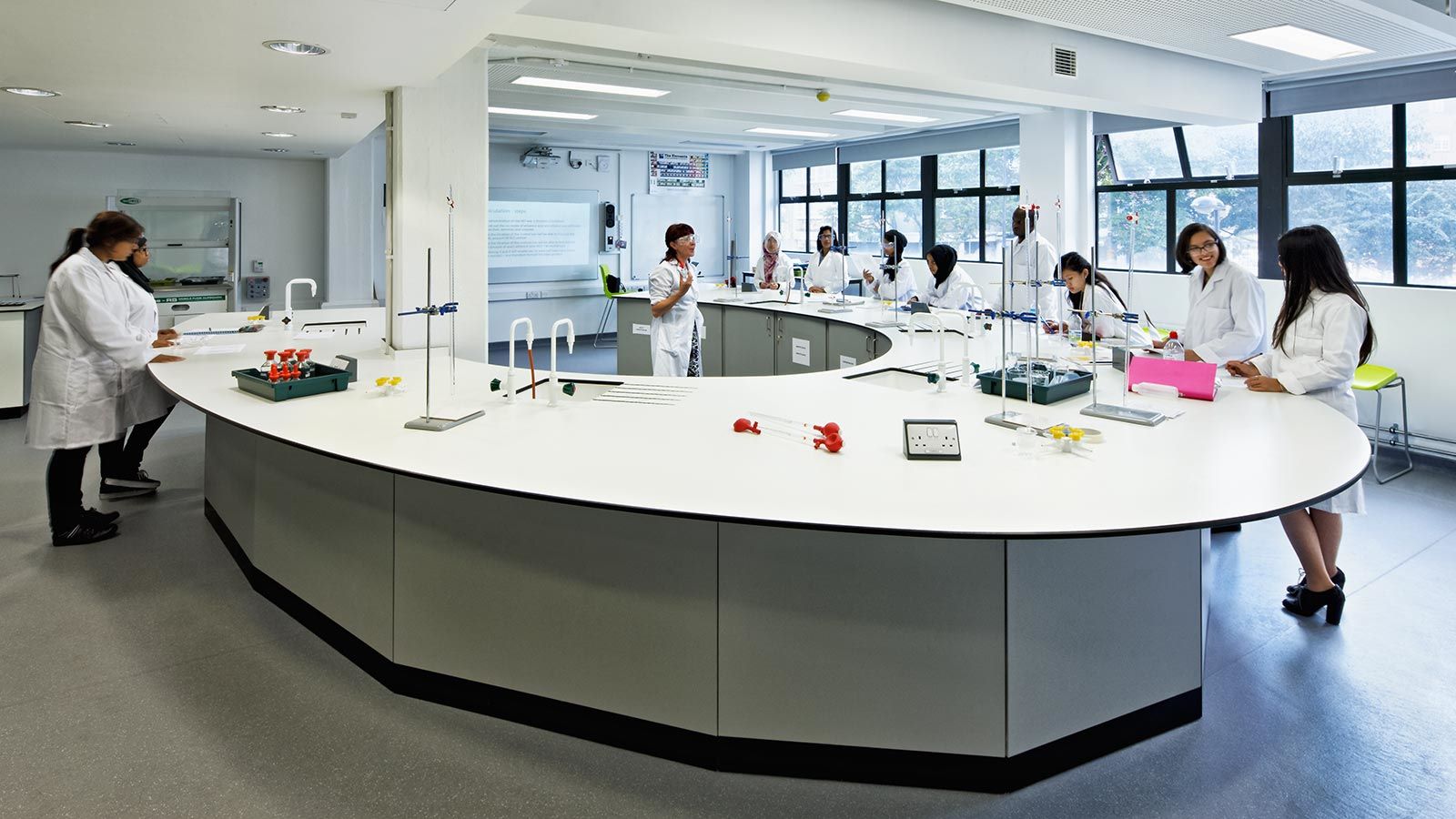 Students in a science laboratory room - Mace Group