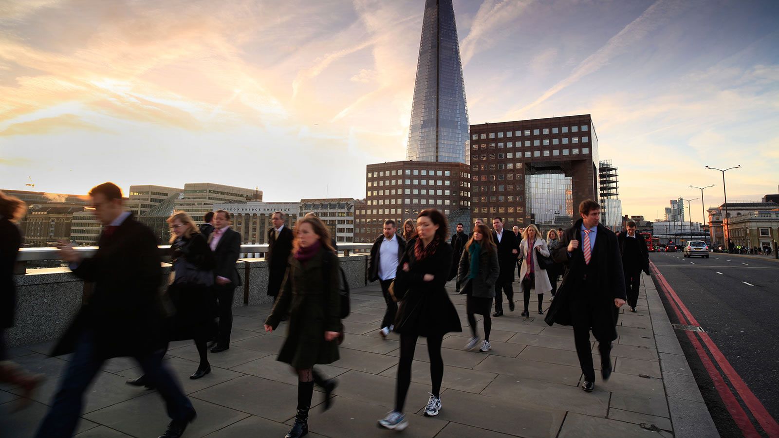 People Walking on London Bridge With The Shard in the Background - Mace Group